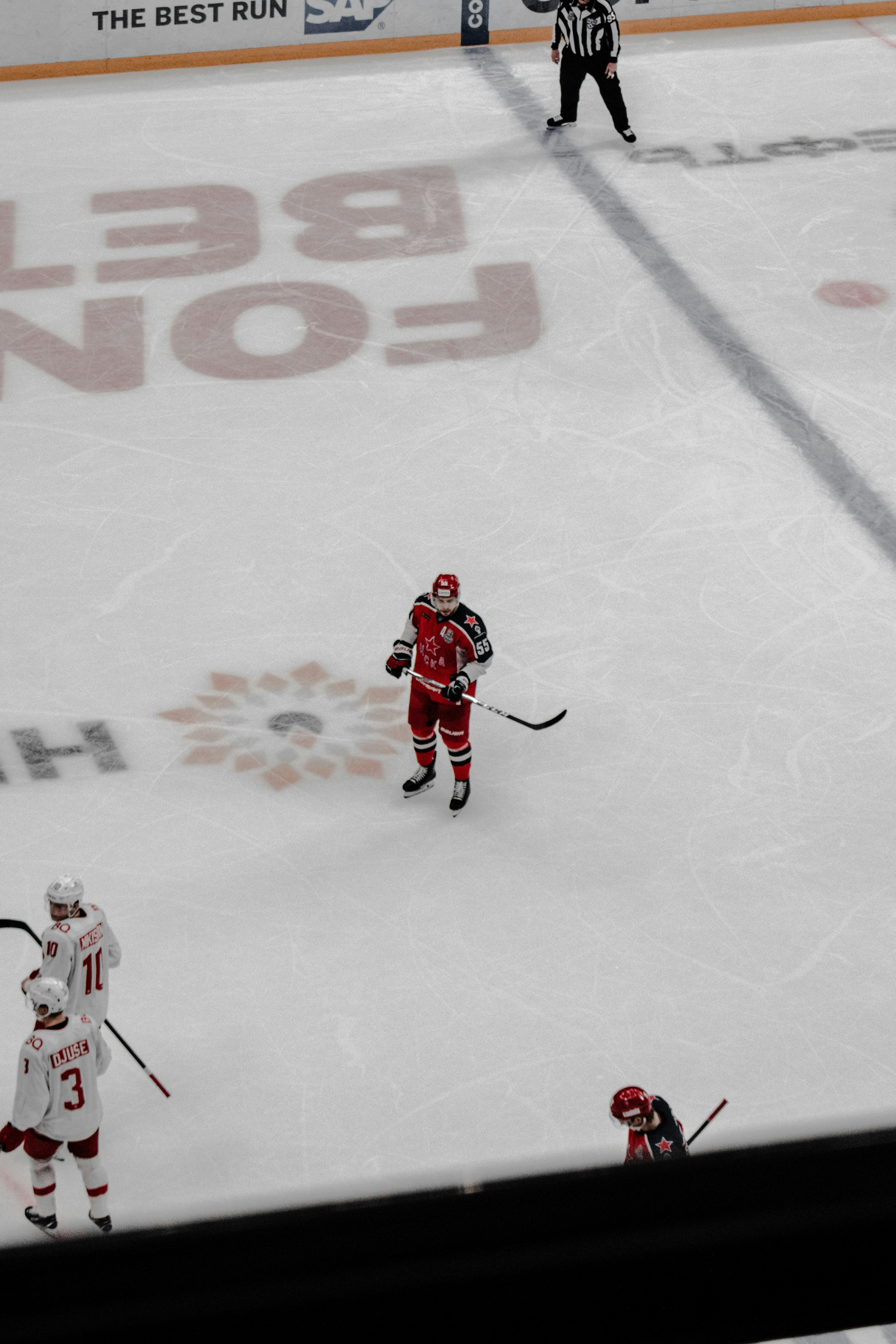 2 men playing ice hockey